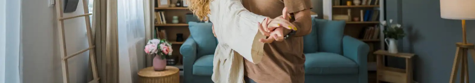 a couple dancing in their home